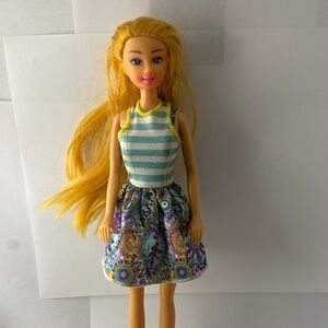 Blonde Fashion Doll in Blue Striped Top and Purple Floral Skirt